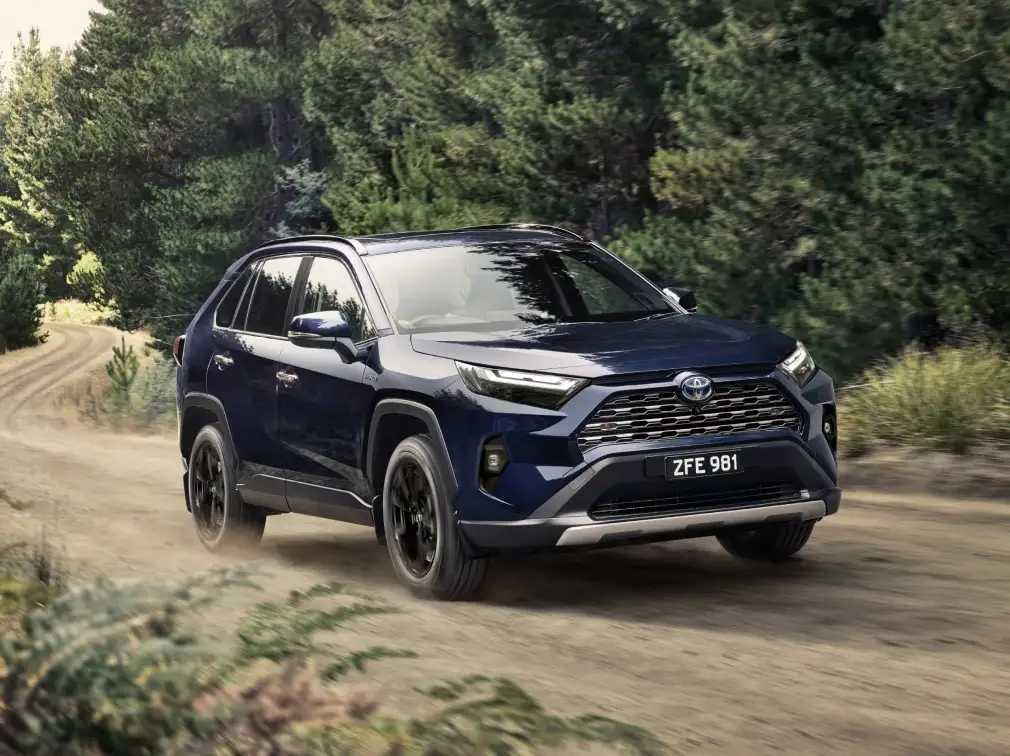 Toyota SUV driving through a forest